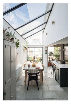 a kitchen with a table and chairs in it