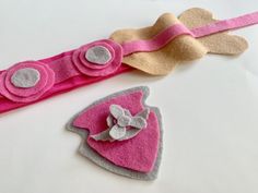 two pieces of felt with flowers on them