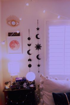 a living room filled with lots of furniture next to a wall mounted sun and moon decorations