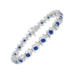 Blue sapphires and sparkling white diamonds are set in a S-link tennis bracelet crafted in cool sterling silver. The bracelet features 20 sparkling diamonds, which have a total weight of .15 carats. The 20 lab-created sapphires add brilliant color to the bracelet, which is built with a box clasp. 'Video Available Upon Request' Product features: Diamond Type: Natural White Diamond Diamond Count: 20 Round-Cut Diamond Diamond Color: H-I Diamond Clarity: I1-I2 Diamond Weight: 0.15cttw Diamond Setting Type: Prong Metal Type: .925 Sterling Silver Gemstone Type: Color Treated Blue Sapphire Gemstone Count: 20 Round-Cut Lab Created Sapphires Gemstone Color: Blue Gemstone Weight: 4.47cttw Bracelet Length: 7.25 inches. Dragonfly Bracelet, Silver Link Bracelet, Fun Bracelet, Blue Sapphire Diamond, Box Clasp, Blue Gemstones, Diamond Color, Sapphire Gemstone, Sparkle Diamonds