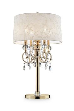 The Aurora crystal chandelier table lamp combine beauty with function. This design features an inner chandelier style light with crystal elements and a barocco drum shade. A charming accent for your living space, chandelier crystal table lamp combine the best of two worlds. Up top is a chandelier style form with gorgeous faceted glass crystals. The crystals appear to be dripping from beneath the barocco shade. Display with shade, or remove it to create a stunning candelabra-like accessory. The solid column base is coated in a yellow gold finish, offering an elegant, old-world feel to the design. Assembly instructions: this fixture comes in 3 different sections. Assemble base to the body pole and connect the light fixtures to the body pole. Place the body harp to the light fixture and place Space Chandelier, Chandelier Table, Chandelier Lamps, Lamp Gold, Crystal Table, Chandelier Table Lamp, French Rococo, Chandelier Crystal, Crystal Table Lamps