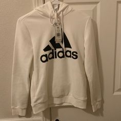 Womens Hoodie Brand: Adidas Color: White/Black Brand New With Tags Never Worn Size: Xs Casual Adidas Logo Fleece Hoodie, Basic White Hoodie With Letter Print, Trendy White Sports Hoodie, White Athleisure Hoodie With Letter Print, White Fleece Hoodie For Spring, White Adidas Logo Sweatshirt For Sports, Adidas White Sweatshirt With Letter Print, White Adidas Sweatshirt With Letter Print, Casual Adidas Logo Hooded Hoodie