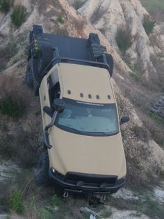 an off - road vehicle is parked on the side of a hill