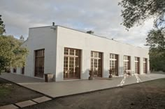 a white building with lots of windows and doors