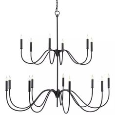 a large chandelier with many lights hanging from it's center and bottom arms