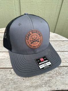 "Gone Hunting - Be Back toon to go Fishing Hat - what more is there to say? We also make and sell full custom Patch hats. Wooden patches, leather patches, cork patches, etc. Please see our other listings to place a custom order with your logo or another desired graphic! PRODUCT DETAILS -------------------------- ~ Richardson 112 trucker style snapback hats ~ Add your logo on our high quality custom made hats. ~ Please get in touch with us or view other listings to order bulk orders of 5+ hats!  HOW TO ORDER ----------------------- 1. Select hat color from the drop-down. All colors/styles are shown in a photo in our listing. 2. Please send us a message including your logo file via Etsy conversation OR email that logo to Sawdustandstuffllc@gmail.com 3. If you would like proof of your design Outdoor Baseball Season Hat With Logo Patch, Leather Patch Baseball Cap For Outdoor Activities, Leather Patch Baseball Cap For Outdoors, Outdoor Leather Patch Baseball Cap, Leather Patch Cap For Outdoor Activities, Brown Outdoor Hats For Father's Day, Brown Hats For Father's Day Outdoor, Brown Outdoor Hat For Father's Day, Father's Day Outdoor Brown Hat