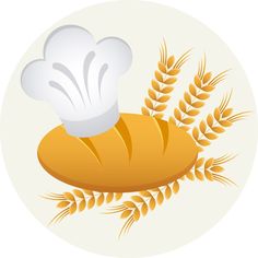 a pastry with a chef's hat sitting on top of it next to some wheat