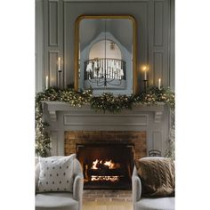 a living room with a fire place and christmas decorations