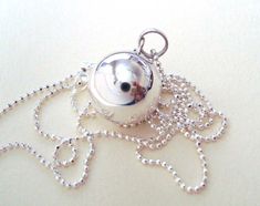 "Musical Harmony ball pendant necklace, Mexican bola, maternity pregnancy ball necklace, angel caller, or guardian bell  This plain sterling silver harmony ball with sterling silver necklace is a great gift  The bola is measure 16mm round with a \"16\" 1mm diamond but bead chain or  1.5mm plain bead chain, or  1.25mm rolo chain they are solid sterling silver,  nickel free and lead free.  chain either made in the USA or Italy. We ship them in a gift box.  They are ready to give away if it is for gift.   Please check out our shop for more selections" Ball Pendant Necklace, Bat Pendant, Flying Bat, Bat Jewelry, Bat Necklace, Metal Bat, Harmony Ball, Locket Ring, Amethyst Birthstone