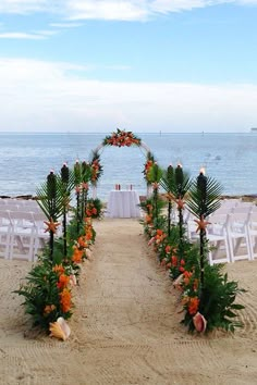 an outdoor wedding set up on the beach