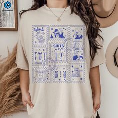 a woman wearing a t - shirt with stamps on it that says sufft