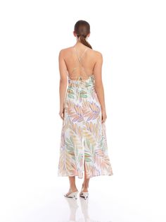 Transport yourself to a tropical paradise with this exotic midi-length dress made of botanical palm print. The lightweight linen fabric provides a breathable feel and drapes beautifully, adding an extra layer of refinement to your look. Ideal for attending a garden party, a beachside soiree, or simply enjoying a leisurely day out, this dress is your go-to choice for effortless style. Botanical Palm Linen Print: 100% Linen Made in the USA of imported fabric Dry Clean Only Length: 52 3/4 inches (s Green Tropical Print Midi Dress For Vacation, Green Tropical Print Midi Dress For Beach, Tropical Print Dress For Garden Party Vacation, Tropical Dresses For Garden Party Vacation, Tropical Dress For Garden Party Vacation, Tropical Style Dress For Garden Party And Vacation, Tropical Midi Dress With Tropical Print For Day Out, Tropical Midi Dress For Day Out, Vacation Linen Dresses With Floral Print