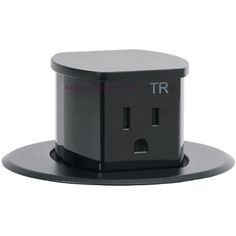 a black and white photo of an electrical outlet with the word tr written on it