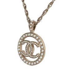 This Chanel round CC pearl pendant necklace with light gold tone hardware and pearls, features a long adjustable rope chainlink necklace with a round pendant with the signature CC in the center beaded with faux pearls and has a lobster clasp closure.Origin: FranceCondition: New and never wornAccompanied by: Chanel box, ribbon, retail UPCMeasurements: chain length (not including pendant): 11.75"; pendant: 1.25" x 1.25" Metal Pendant Necklace, Chanel Box, New Metal, Pearl Pendant Necklace, Cc Logo, Metal Pendant, Round Pendant, Gold Pendant Necklace, Pearl Pendant