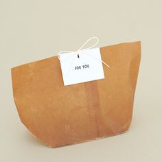 a brown paper bag with a tag on it