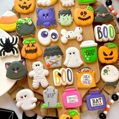 decorated cookies are arranged in the shape of a halloween tree