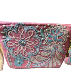 Our unique and beautiful hand embroidered "cosmetic bags" can be used to carry all your beauty essentials, perfect for daily use and ideal for travel; as well as convert to a Crossbody Bag. Made by female Artisans from Peru from hand loomed wool yarns, with hand embroidered coloful emblishements. Each tasseled bag has cotton lining and detachable matching wool braided strap. 11 1/2 "x 8" x 3" They are designed to be the perfect gift to make someone feel special! Embroidered Tote Beach Bag, Handmade Pink Bag For Personal Use, Embroidered Rectangular Beach Bag For Everyday Use, Embroidered Shoulder Beach Bag For Daily Use, Rectangular Embroidered Beach Bag For Everyday Use, Rectangular Bags With Multicolor Embroidery And Adjustable Strap, Rectangular Bag With Multicolor Embroidery And Adjustable Strap, Multicolor Embroidered Rectangular Bags With Adjustable Strap, Travel Shoulder Bag With Floral Embroidery