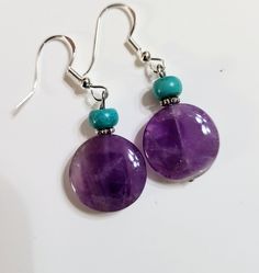 22mm round purple amethyst, silver spacers, 6mm rondelle shaped turquoise gemstones.  Sterling silver earwires. Turquoise Gemstone, Purple Amethyst, Jewelry Earrings Dangle, Dangle Drop Earrings, Violet, Dangle Earrings, Amethyst, Handmade Items, Jewelry Earrings