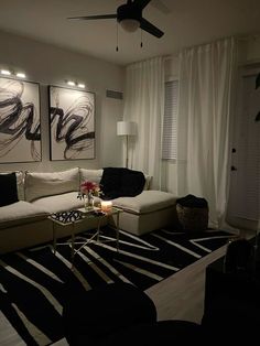 a living room with black and white decor