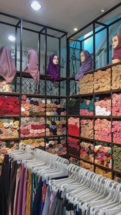 a store filled with lots of different colored clothing