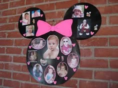 a mickey mouse head with many pictures on it and a pink bow hanging from the side