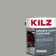 a gray paint with the words kiz on it and a red truck in the background