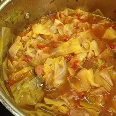 a close up view of some food in a bowl with broth and vegetables on it