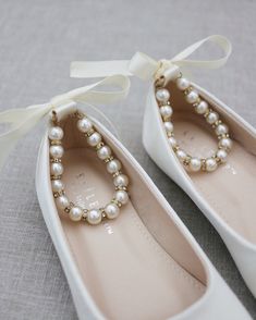 Satin flats with gorgeous row of pearls and gold beads rhinestones ankle strap for a girl who is looking for comfort and simple chic style. Perfect for flower girls, pair up with tutu ballerinas, fairies or birthday parties. DETAILS: COLORS AVAILABLE: White, Off White, Ivory, Black, Blush Pink, Champagne, Light Blue and BurgundyUPPER: Synthetic upper and liningMATERIALS: Mandmade outsoleORIGIN: ImportedSTYLE NAME: HARPER-57 Flat Pearl Wedding Shoes, Wedding Flats Pearls, Pearl Embellished Wedding Flats, Elegant Pearl-embellished Formal Flats, Simple Chic Style, Girls Ballet Flats, Shoes For Girls, Black Blush, Simple Chic