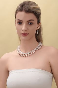 Embrace the opulence of our Vintage Triple-Layer Handcrafted Pearl Necklace, ideal for banquets and weddings. This exquisite piece features three sizes of near-round and oval-shaped pearls, meticulously handcrafted into a luxurious three-layer design. The necklace measures 40cm with an additional 5cm extension, offering flexibility and a perfect fit for any formal attire. Product Details: Pearl Types: Various Sizes, Near-Round and Oval Shapes Craftsmanship: Pure Handcrafted Style: Vintage Luxury Length: 40cm + 5cm Extension Occasion: Perfect for Banquets, Weddings Design: Triple-Layer Pearls This necklace's classic styling and intricate handcrafting make it a stunning choice for anyone looking to add a touch of vintage elegance and grandeur to their ensemble. Product Information Pearl Type Exquisite Bridal Necklace For Evening, Exquisite Round Bridal Necklace For Evening, Exquisite Pearl Necklace For Formal Occasions, Luxury Beaded Pearl Necklace For Evening, Exquisite Formal Pearl Necklace, Elegant Oval Necklaces For Party, Elegant Oval Bridal Necklace For Formal Occasions, Luxury Oval Bridal Necklace, Luxury Pearl Necklace For Evening