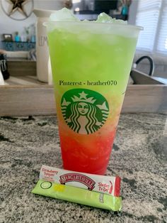 a drink and candy bar sitting on top of a counter