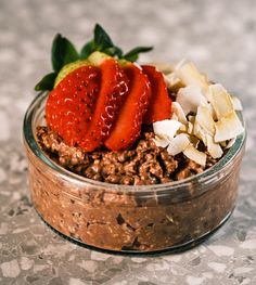 a close up of a bowl of food with strawberries