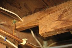 the inside of a wooden structure with wires