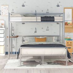 a bedroom with a bunk bed, desk and dresser next to it in front of a wallpapered wall