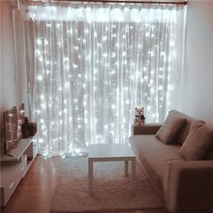 a living room filled with furniture and lights