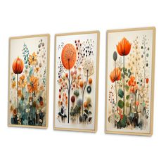 three framed art pieces with flowers and leaves on them, one is orange the other is white