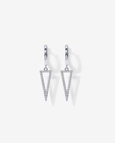 Bring the heat this summer with a sleek suite of sterling silver PAVOI's Dangle Huggie Earrings. Materials: 14K yellow, rose or white gold plated Measurements: 13mm Outer Diameter, 9.1mm Inner Diameter Huggie; Thickness: 1.4mm