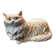 a white and orange cat figurine on a white background