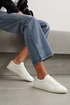 SAINT LAURENT's pristine white 'Andy' sneakers will go with just about everything in your closet. They're made from smooth leather and stamped with the label's logo in gold lettering. The secret to keeping them box-fresh? Use a clean, damp cloth to remove smudges and marks. Saint Laurent Sneakers, Best White Sneakers, Saint Laurent Shirt, Saint Laurent Jeans, High Fashion Looks, White Sneakers Women, White Leather Sneakers, French Women, Saint Laurent Shoes