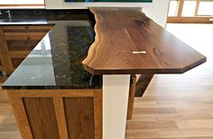 a wooden counter top sitting inside of a kitchen