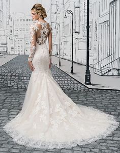 a woman in a wedding dress standing on a cobblestone street with her back to the camera