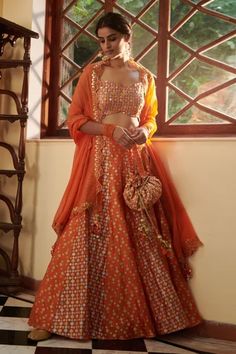 Shop for Seema Nanda Orange Chanderi Silk Noor Printed Lehenga Set for Women Online at Aza Fashions Transitional Floor-length Choli With Gota Work, Festive Designer Choli With Gota Work, Transitional Chanderi Lehenga With Gota Work, Transitional Chanderi Lehenga With Mirror Work, Designer Chanderi Choli With Gota Work, Bollywood Style Orange Choli For Transitional Season, Transitional Season Unstitched Gota Work Choli, Festival Reception Palazzo Set With Cutdana, Designer Choli With Gota Work In Traditional Drape