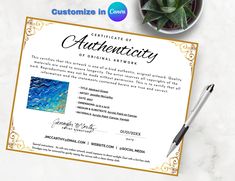 certificate of authenticity on top of a desk next to a pen and potted plant