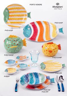 an assortment of colorful plates and bowls with fish on them