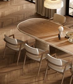 a wooden table with chairs around it and a lamp hanging from the ceiling over it