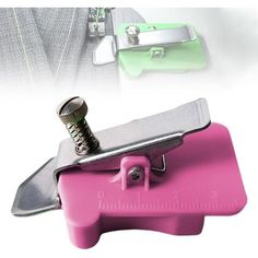 a pink and green tool holder with a screwdriver on it's side