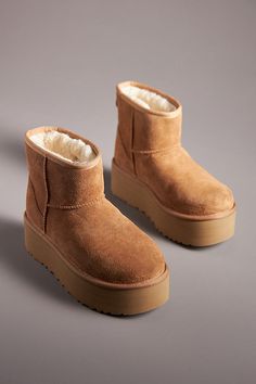 * Suede upper* Sheepskin wool insole* Rubber sole* Pull-on styling* Imported Ugg Boots Aesthetic, Ugg Classic Mini Platform, Anthropologie Gifts, Mini Uggs, Ugg Boot, Xmas Wishes, Ugg Mini, 2024 Style, Ugg Classic Mini