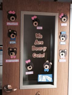 a bulletin board with teddy bear cutouts on it and magnets attached to the wall