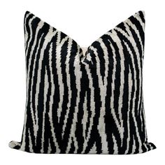 a black and white zebra print pillow on a white background