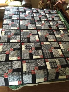 a black and white quilt on a table