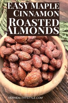 a wooden bowl filled with roasted almonds and the words easy maple cinnamon roasted almonds